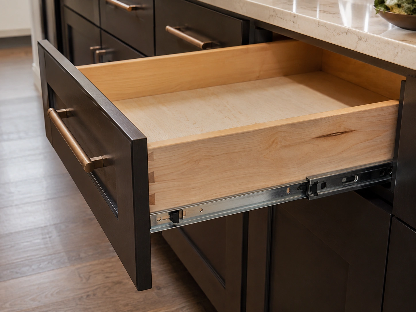 Cabinet construction detail showing soft-close drawer slides in a DFW kitchen