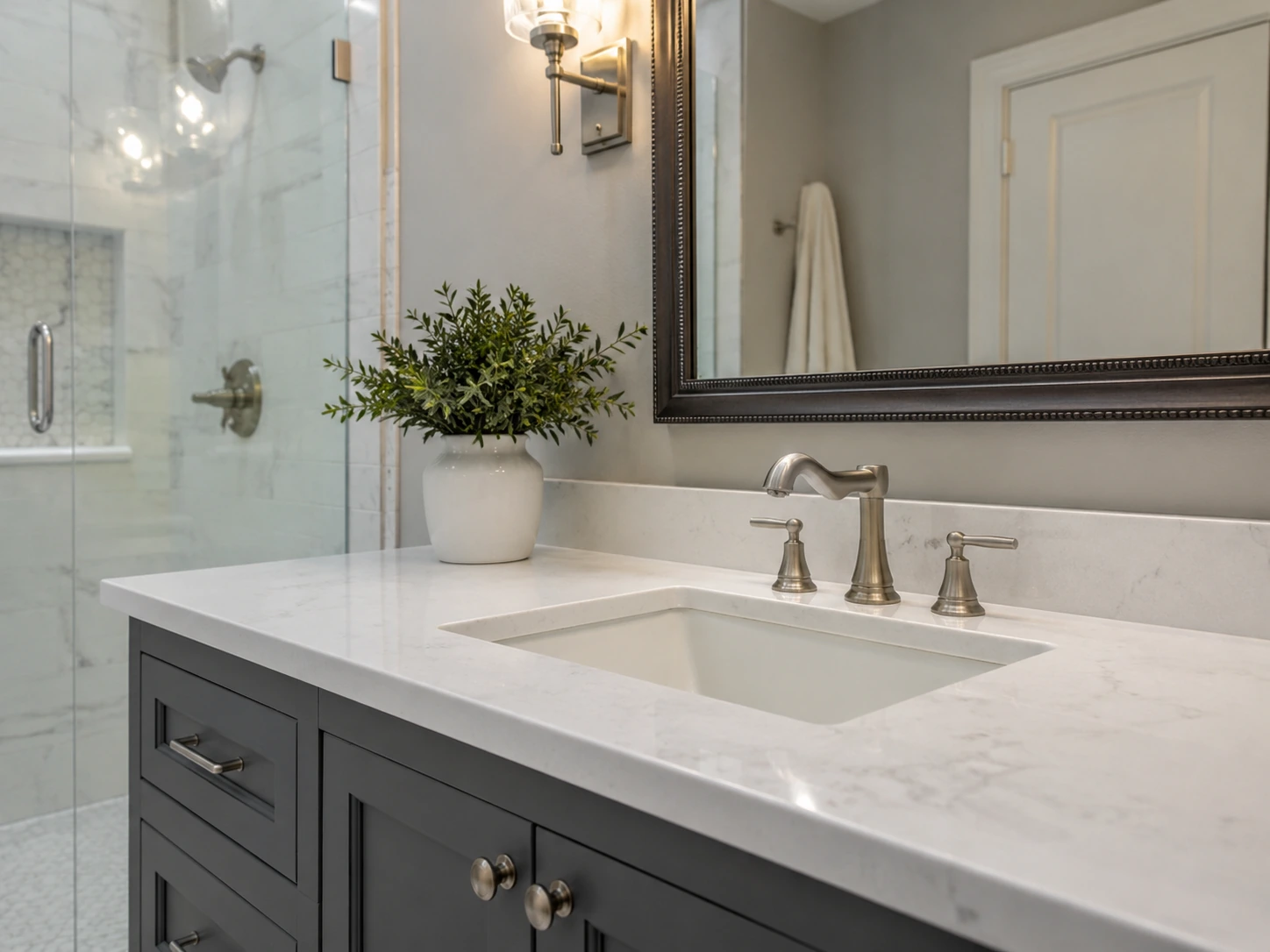 Finished bathroom remodel detail showing vanity and tile work in a DFW home